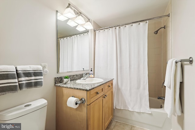 full bathroom featuring toilet, shower / bath combo, vanity, and tile patterned floors