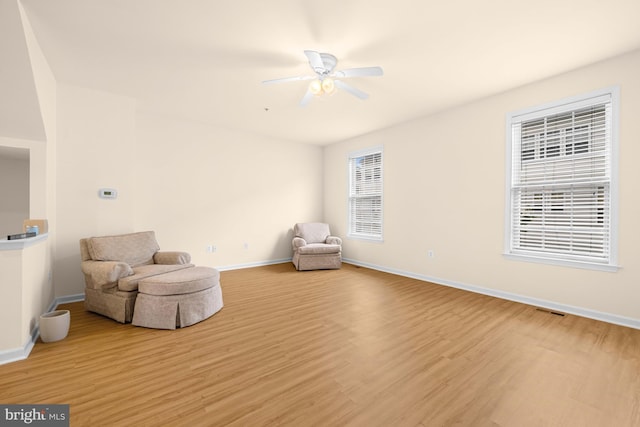 unfurnished room with ceiling fan and light hardwood / wood-style floors