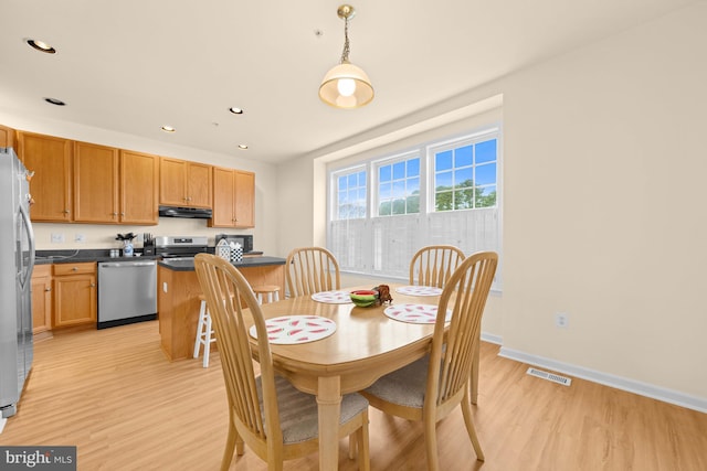 dining room featuring light hardwood / wood-style flooring