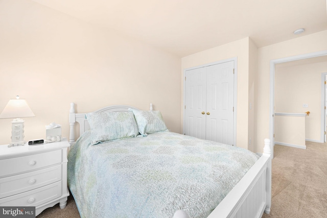 carpeted bedroom featuring a closet