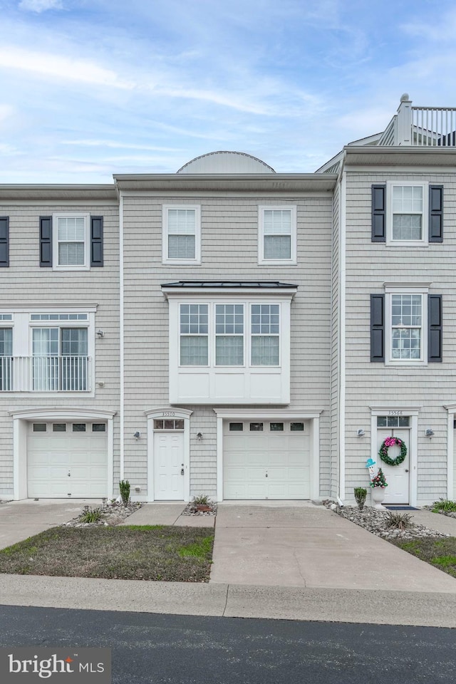 multi unit property featuring a garage