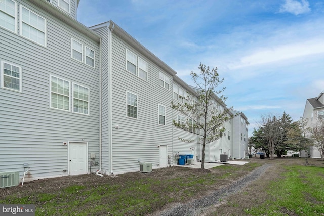 view of home's exterior with central AC unit