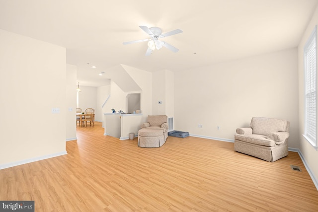 sitting room featuring ceiling fan and light hardwood / wood-style floors