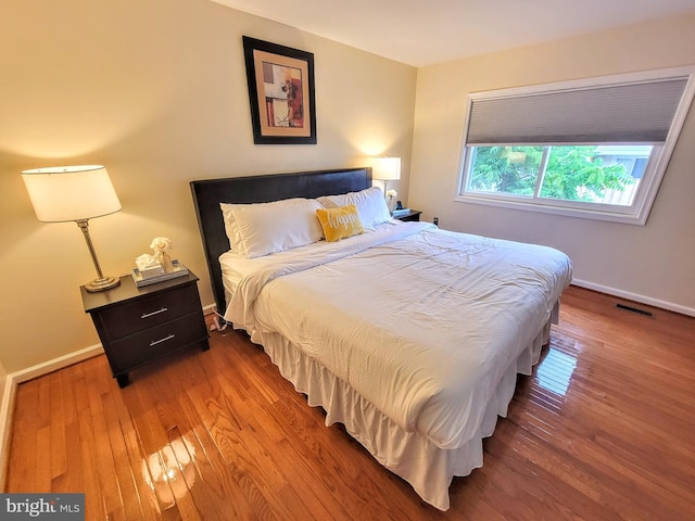 bedroom featuring wood-type flooring