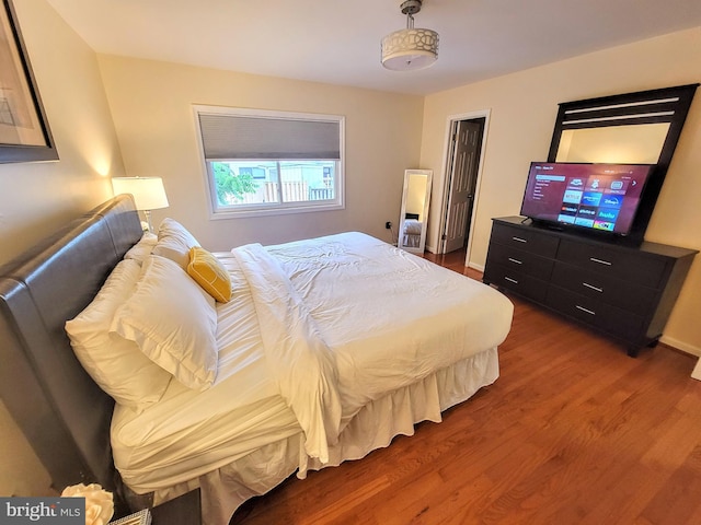 bedroom with hardwood / wood-style flooring