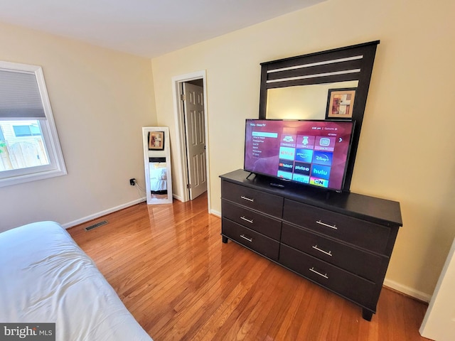 bedroom featuring wood-type flooring