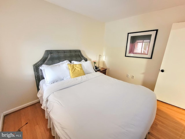 bedroom featuring wood-type flooring