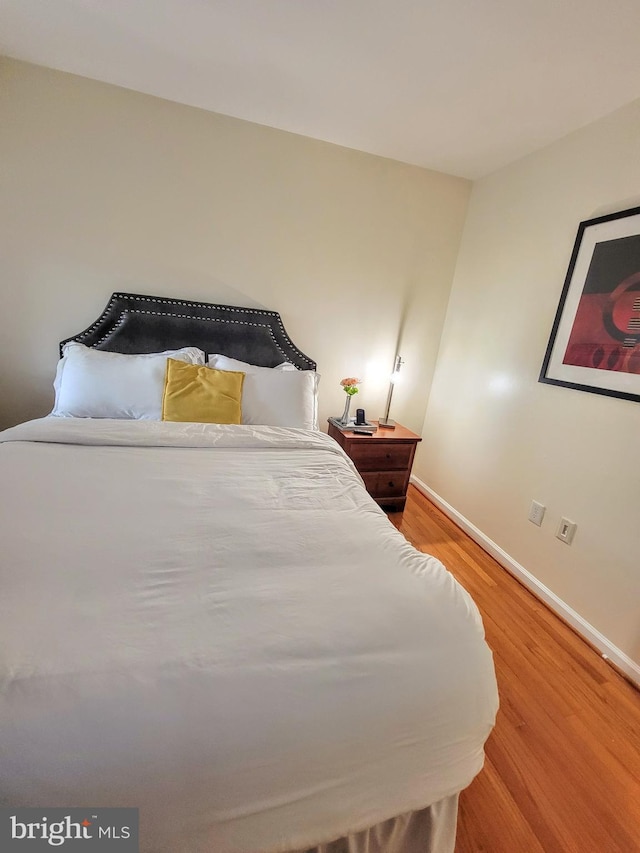 bedroom featuring hardwood / wood-style flooring