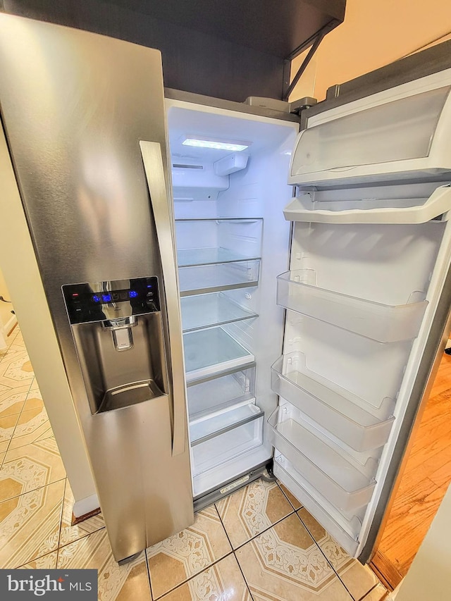 room details featuring stainless steel refrigerator