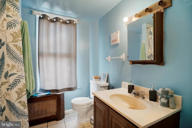 bathroom with tile patterned floors, vanity, and toilet