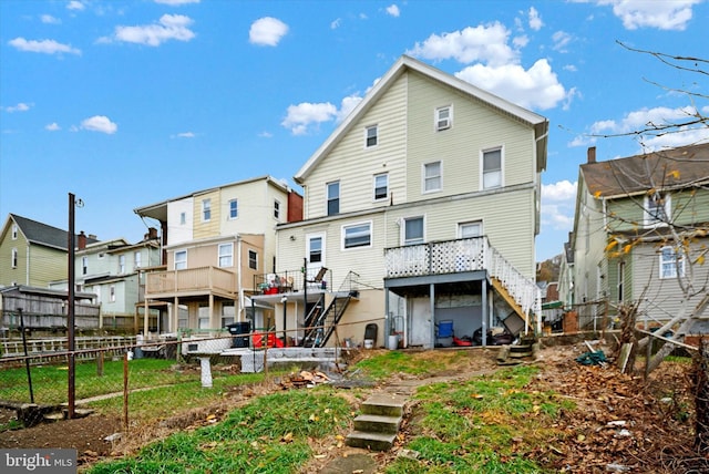 back of property with a wooden deck