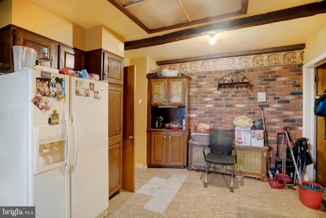 kitchen with white refrigerator with ice dispenser