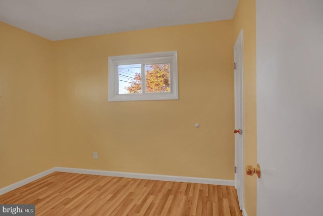 spare room with light wood-type flooring