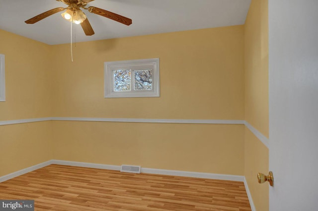 unfurnished room featuring ceiling fan and light wood-type flooring