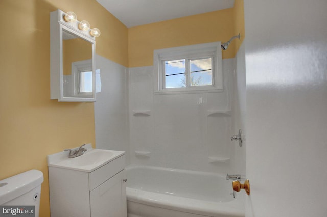 full bathroom with shower / bathing tub combination, vanity, and toilet