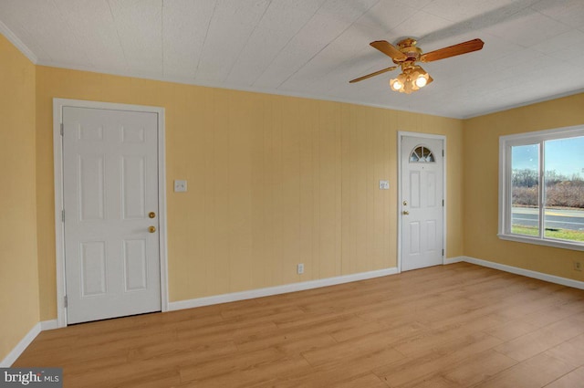 foyer featuring ceiling fan and light hardwood / wood-style flooring