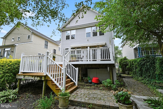 rear view of property with a wooden deck