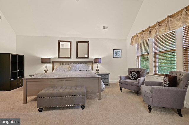 carpeted bedroom featuring lofted ceiling