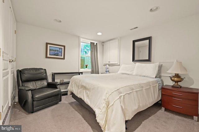 bedroom with light colored carpet