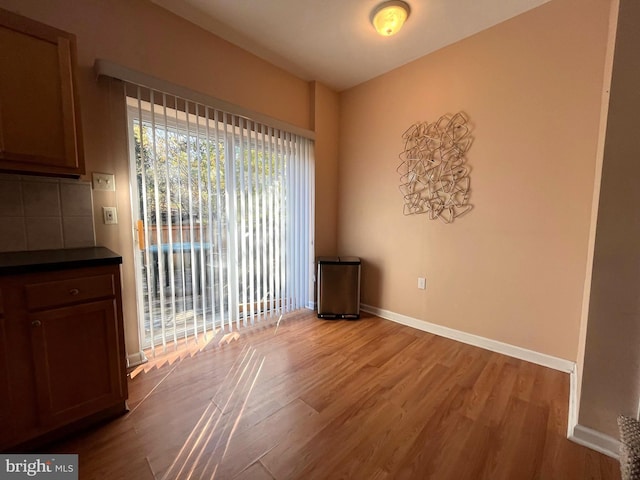 unfurnished dining area with hardwood / wood-style floors