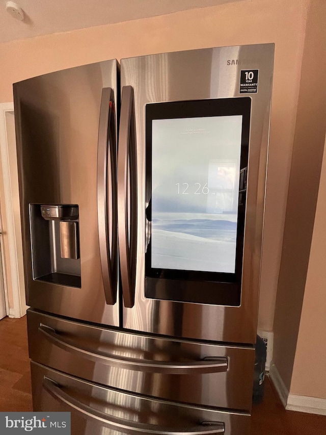 room details with stainless steel fridge with ice dispenser