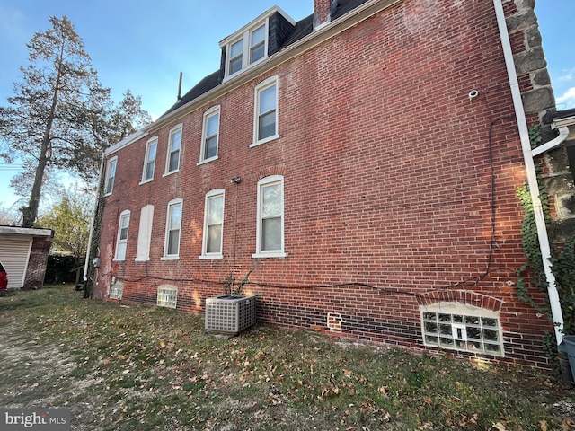 view of home's exterior with central AC unit