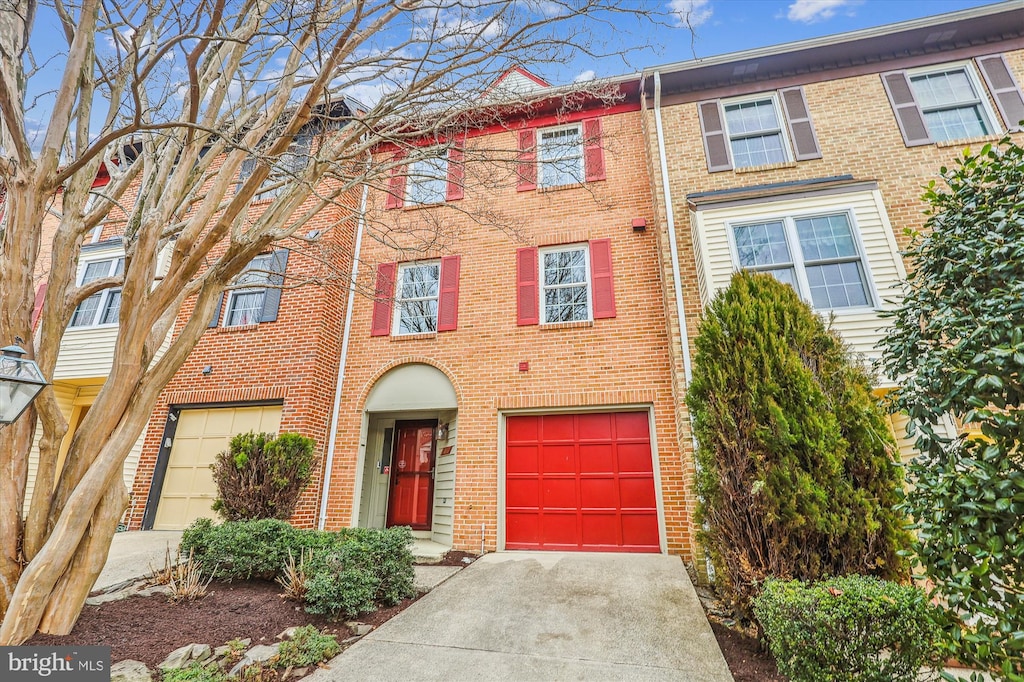 townhome / multi-family property featuring a garage