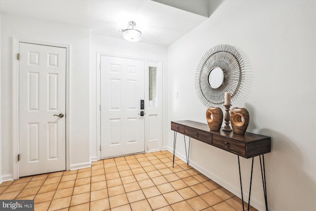 foyer entrance with light tile patterned floors