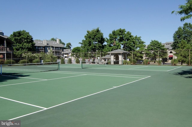 view of tennis court featuring basketball court