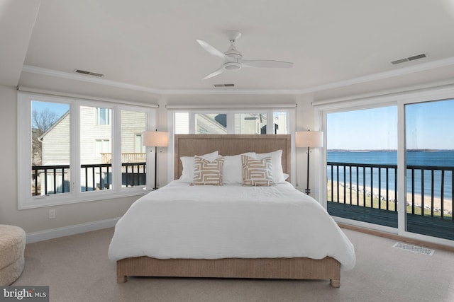 bedroom with light carpet, access to outside, a water view, crown molding, and ceiling fan