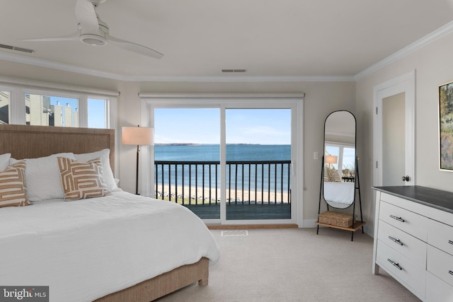 bedroom with access to exterior, ceiling fan, light colored carpet, multiple windows, and a water view