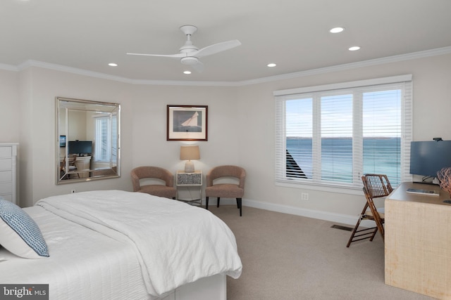 carpeted bedroom featuring ceiling fan and crown molding