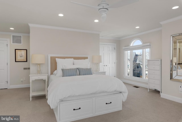 carpeted bedroom featuring ceiling fan and ornamental molding