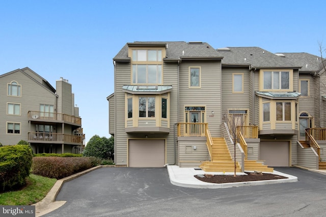 townhome / multi-family property featuring a garage