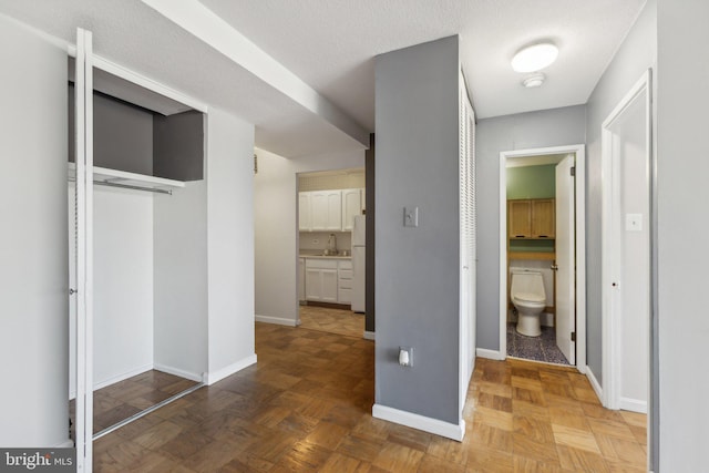 1301 Delaware Ave SW Unit N523, Washington, DC 20024 - hallway with a sink and baseboards