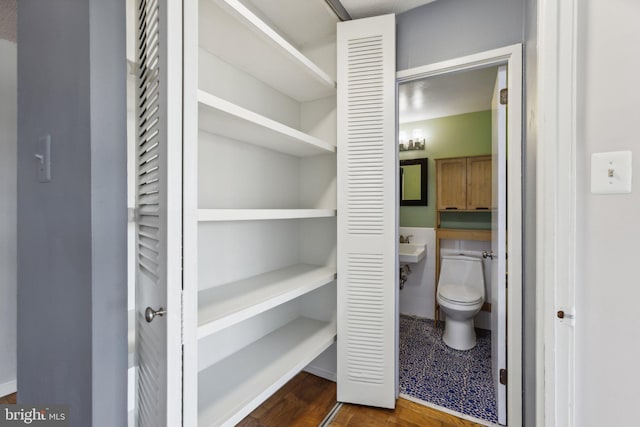 1301 Delaware Ave SW Unit N523, Washington, DC 20024 - bathroom featuring a closet, toilet, and wood finished floors