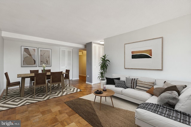 living room featuring parquet floors