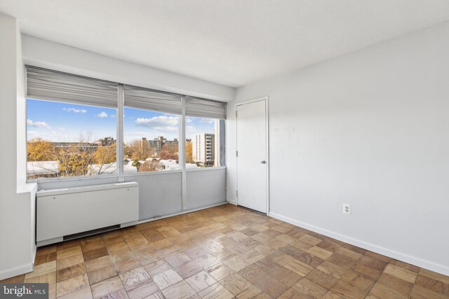 1301 Delaware Ave SW Unit N523, Washington, DC 20024 - unfurnished room with radiator heating unit and baseboards