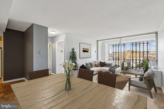 dining area with hardwood / wood-style floors