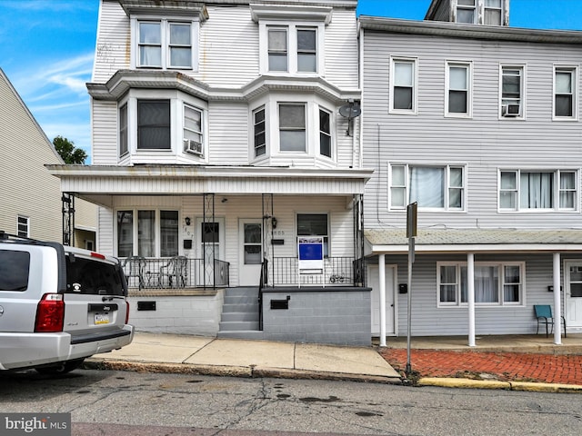 view of property with covered porch