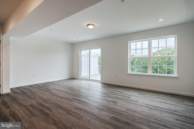 unfurnished room featuring dark wood-type flooring