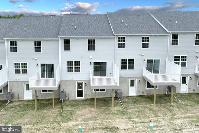 rear view of property featuring cooling unit