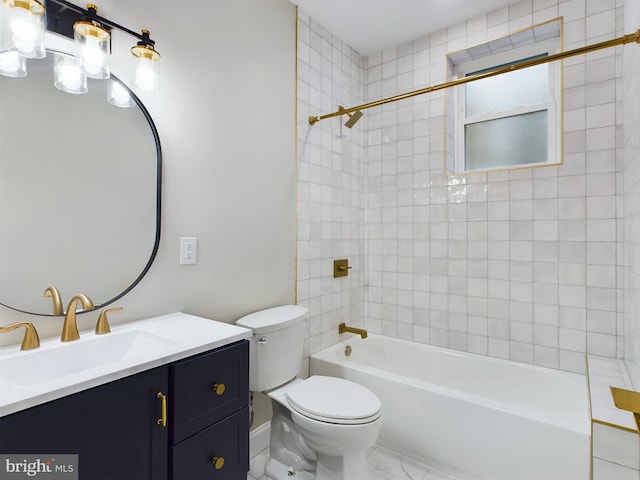 full bathroom featuring tiled shower / bath, vanity, and toilet