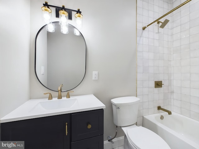 full bathroom with vanity, toilet, and tiled shower / bath combo