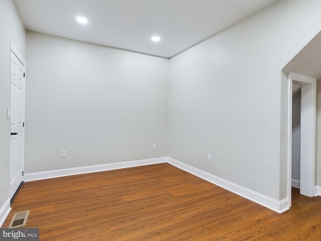 empty room with dark hardwood / wood-style floors