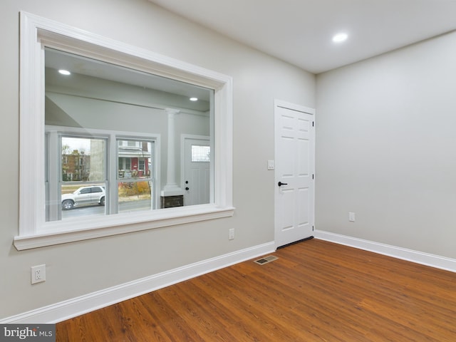 spare room featuring hardwood / wood-style flooring