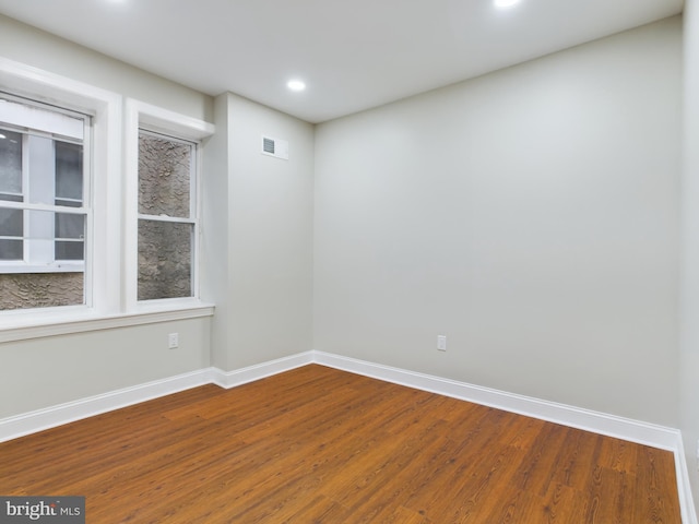 spare room featuring hardwood / wood-style flooring