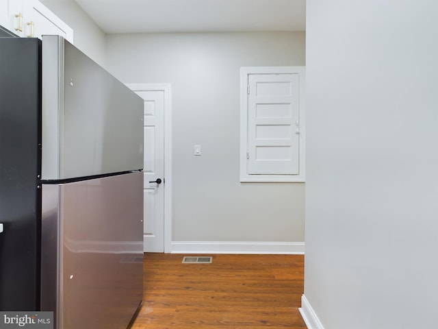 hallway featuring hardwood / wood-style flooring