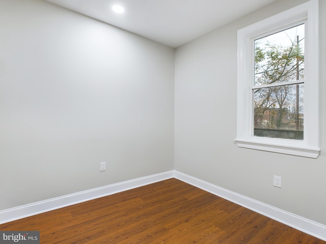 spare room featuring hardwood / wood-style floors