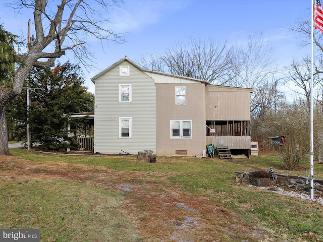 view of property exterior with a lawn